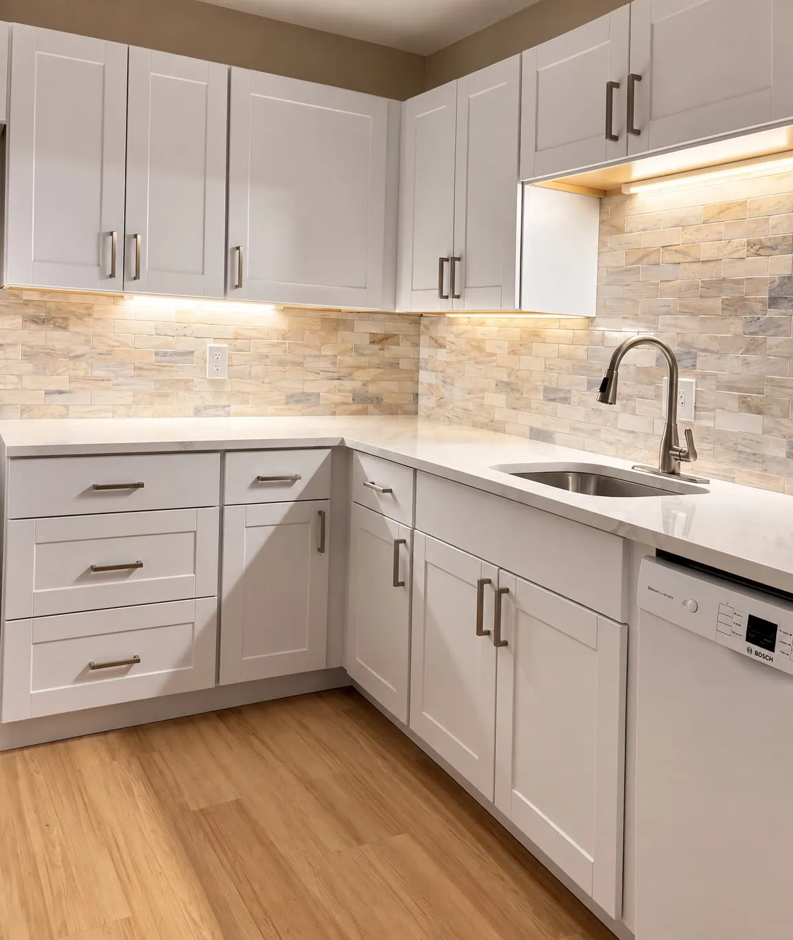 Finished kitchen with stone backsplash and under-cabinet lighting